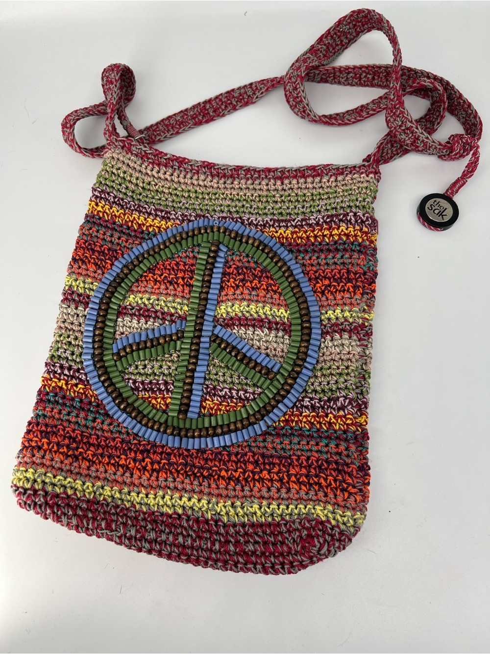 The Sak Handwoven boho Multicolor beaded Peace Sign Crossbody Bag